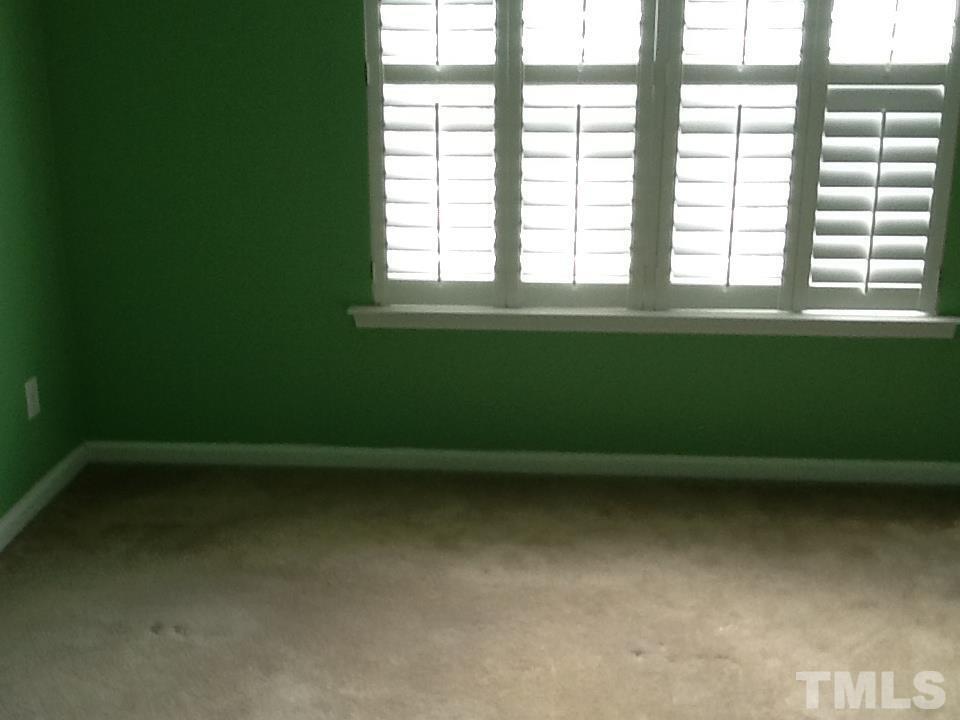 11417 Shadow Elms Lane Raleigh, NC 27614 - Photo 13 of 19 a view of a room with window and a ceiling fan