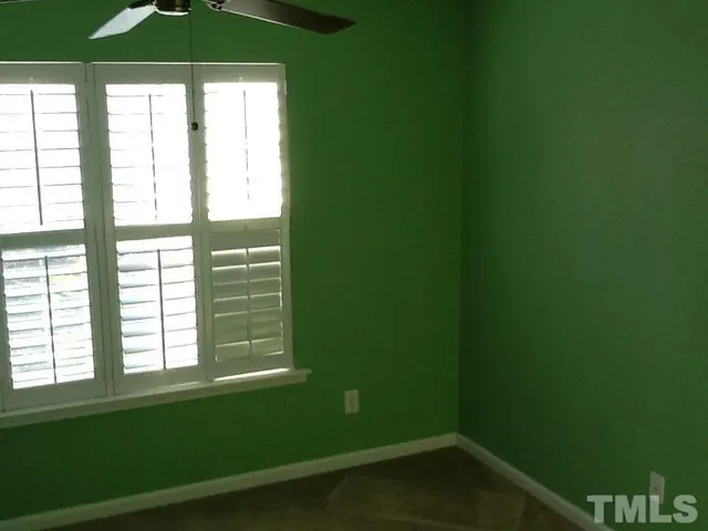 a bathroom with a window and a shower