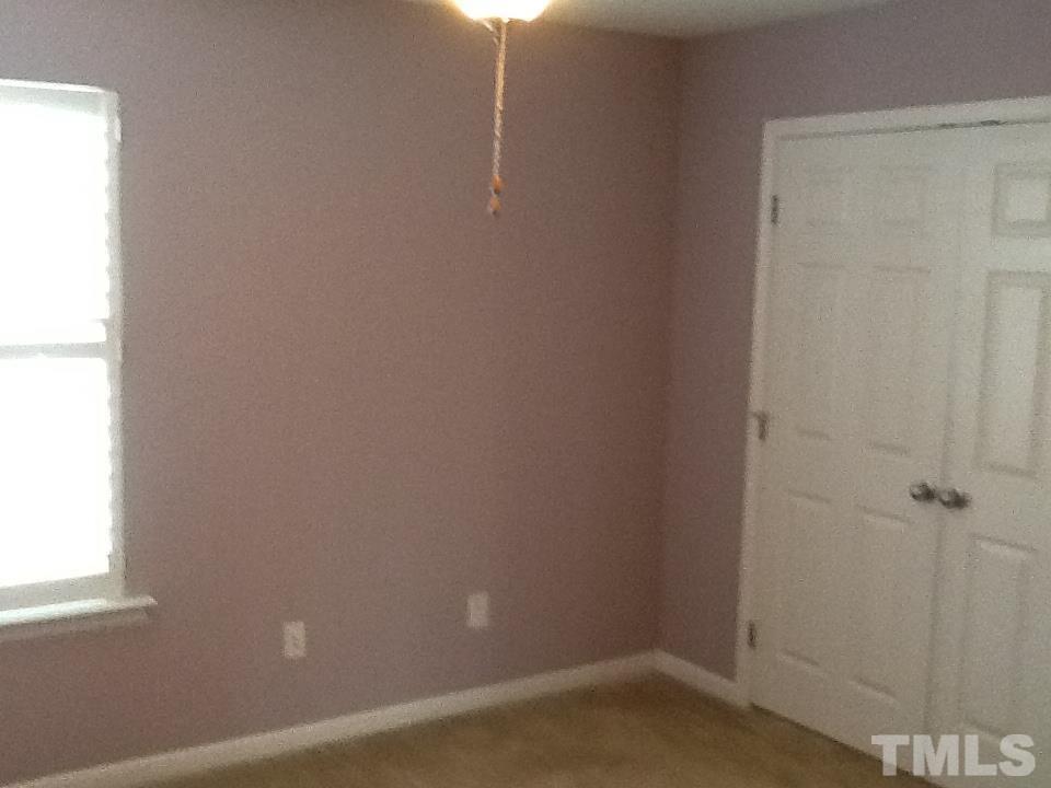 11417 Shadow Elms Lane Raleigh, NC 27614 - Photo 16 of 19 a room that has a window in it