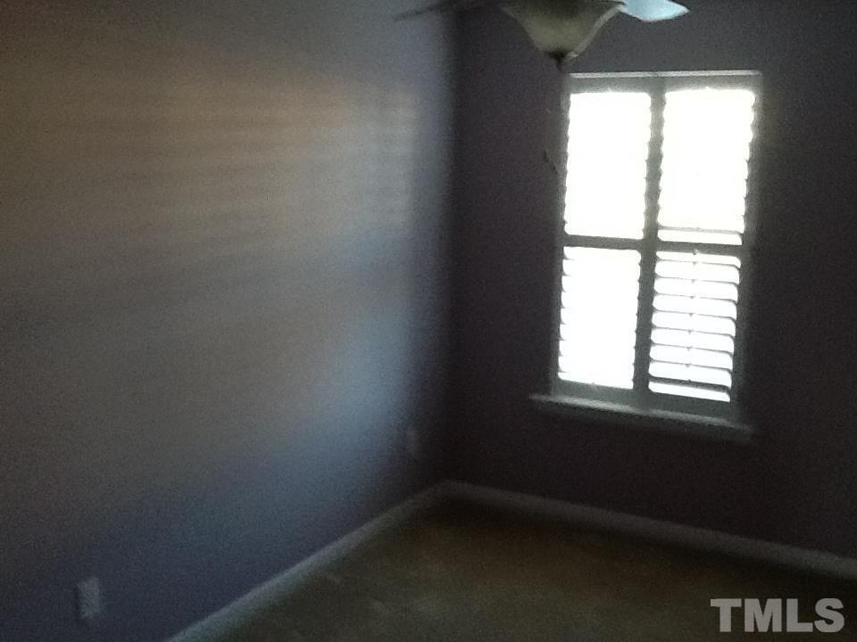 11417 Shadow Elms Lane Raleigh, NC 27614 - Photo 17 of 19 an empty room with a window