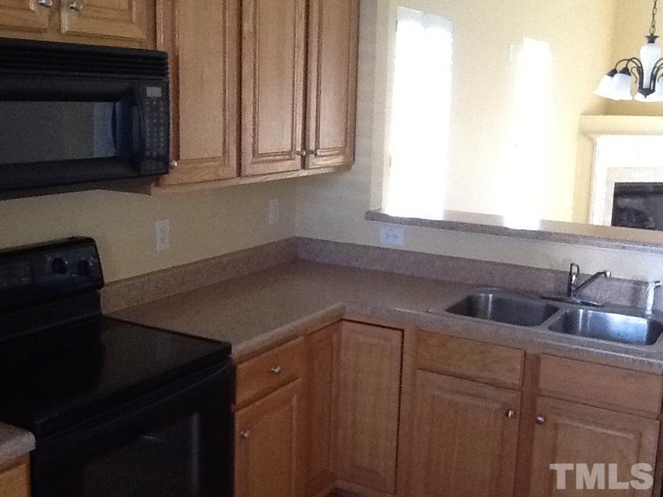 11417 Shadow Elms Lane Raleigh, NC 27614 - Photo 4 of 19 a kitchen with a sink cabinets and a window