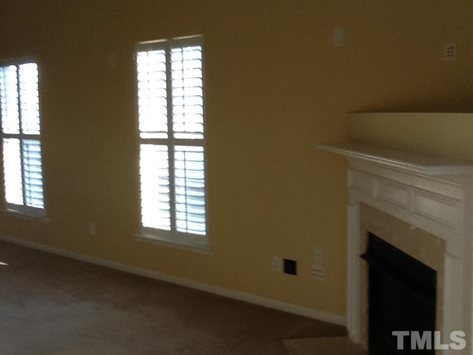11417 Shadow Elms Lane Raleigh, NC 27614 - Photo 8 of 19 a view of empty room with windows