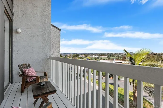 a view of a city with lawn chairs