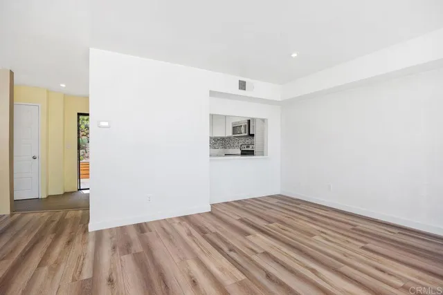 a kitchen with a sink stove and refrigerator