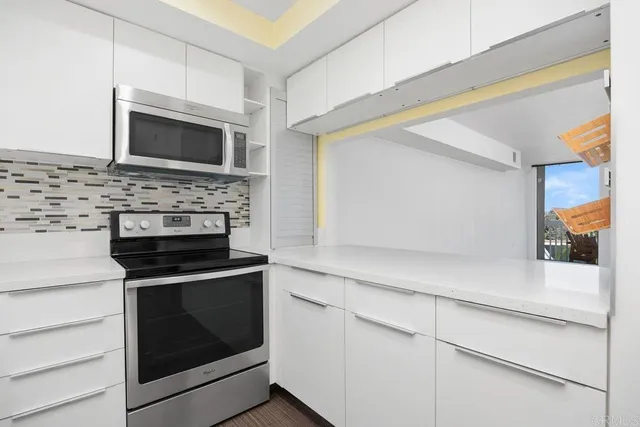 a bathroom with a bathtub and a window