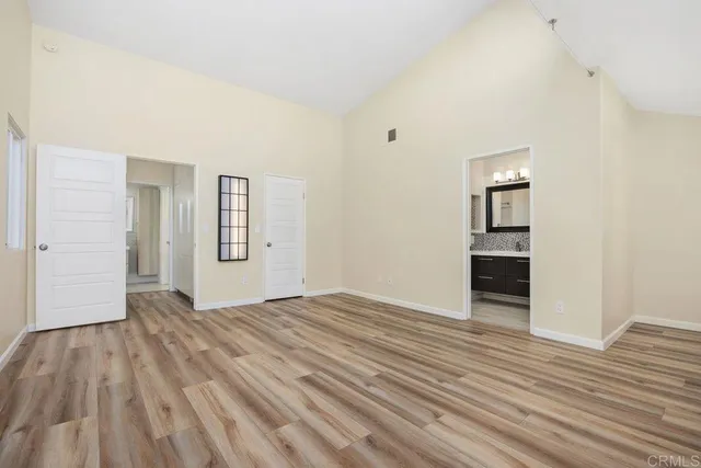 a bathroom with a bathtub sink vanity mirror and toilet