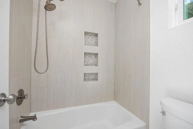 a view of two chairs in the patio