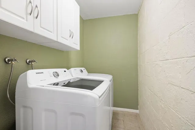 an aerial view of a residential houses with city view