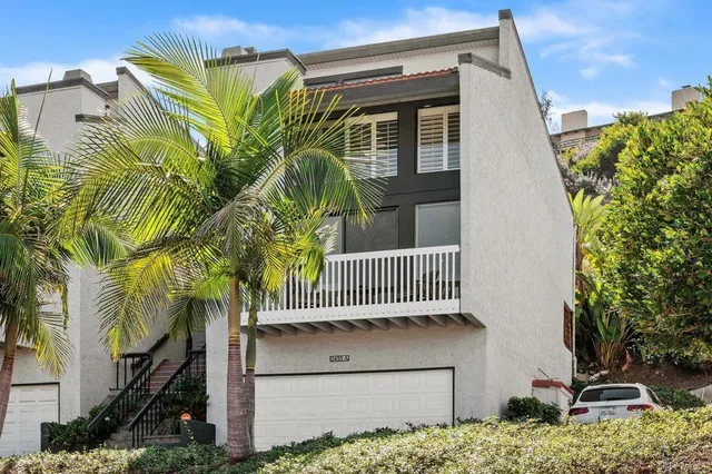 a balcony with a tree