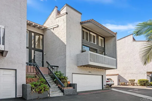 a front view of a house with a garage