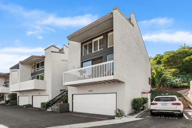 a car parked in front of a house