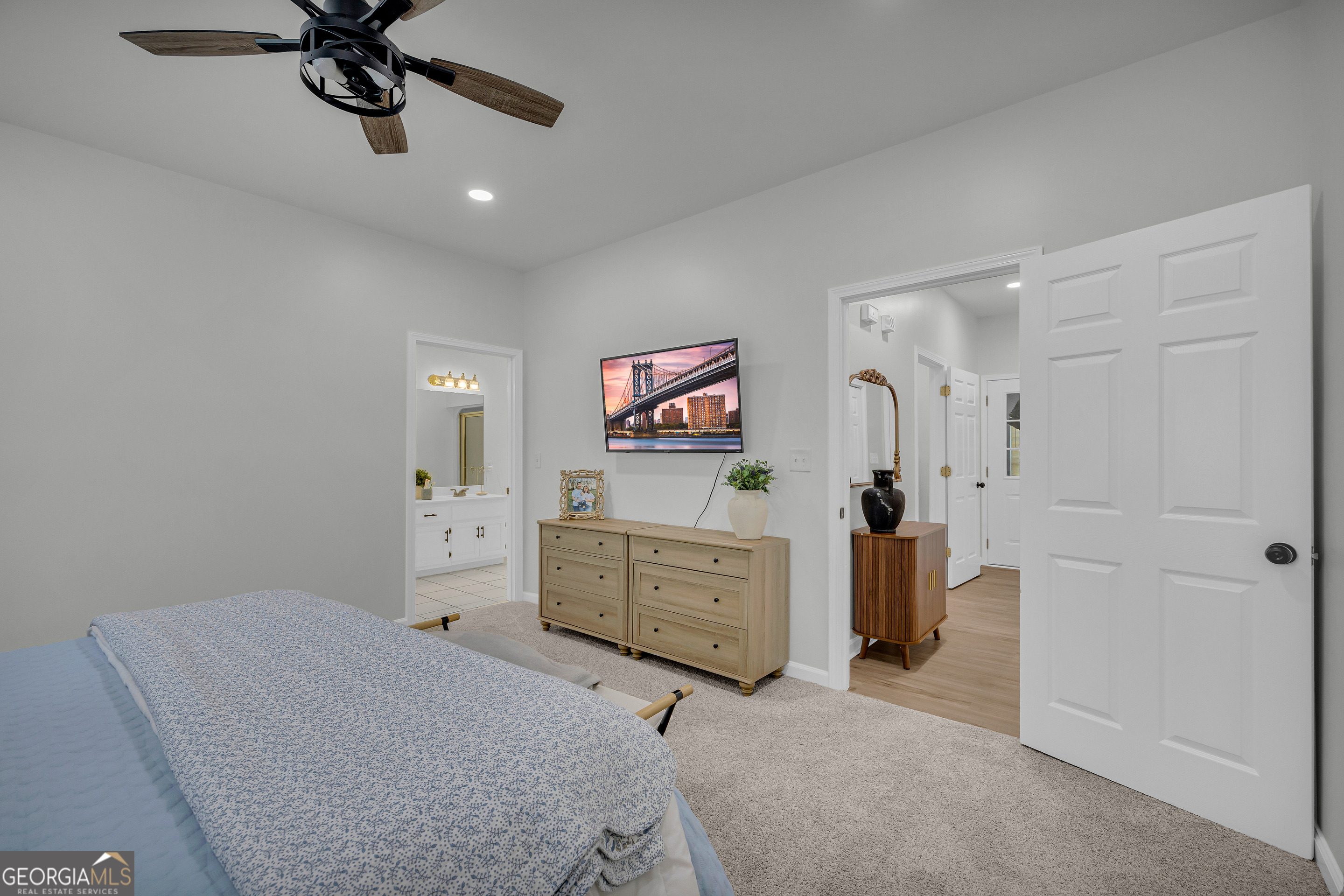 163 Tuxedo Drive Commerce, GA 30530 - Photo 33 of 62 a bed room with a bed and a dresser