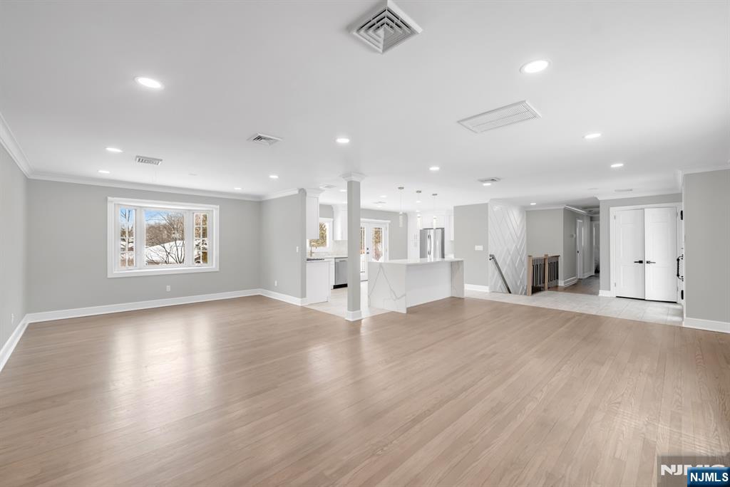 475 Cedar Lane Paramus, NJ 07652 - Photo 1 of 31 a view of an empty room with wooden floor and a window