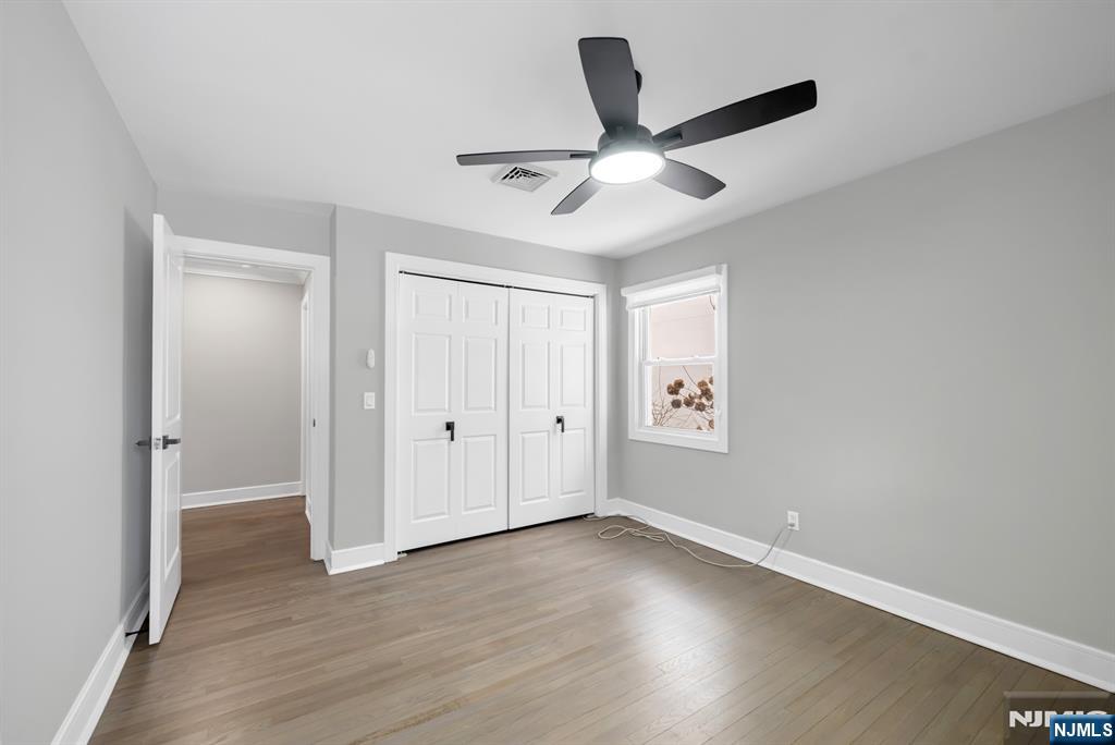 475 Cedar Lane Paramus, NJ 07652 - Photo 14 of 31 a view of an empty room with wooden floor