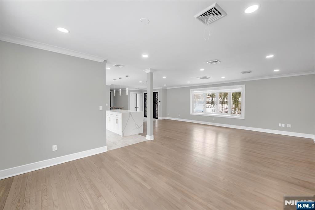 475 Cedar Lane Paramus, NJ 07652 - Photo 2 of 31 a view of a big room with wooden floor and windows