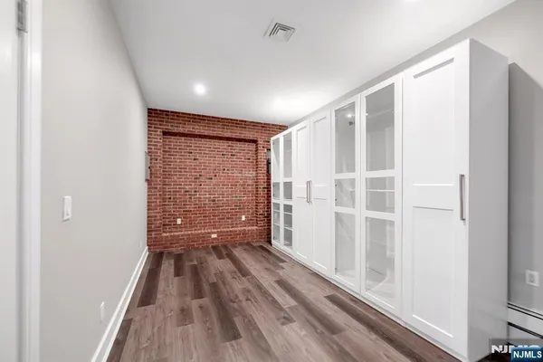 a view of entryway with wooden floor