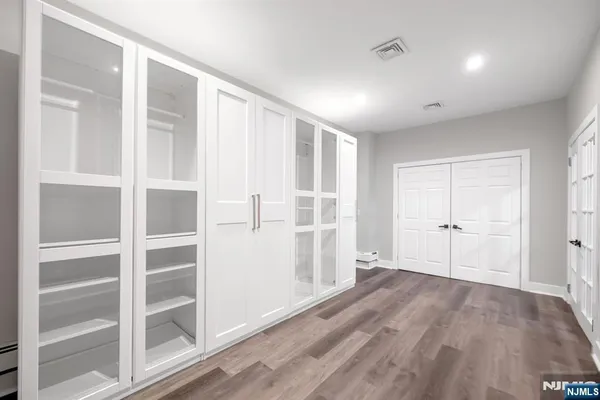 a view of a livingroom with wooden floor