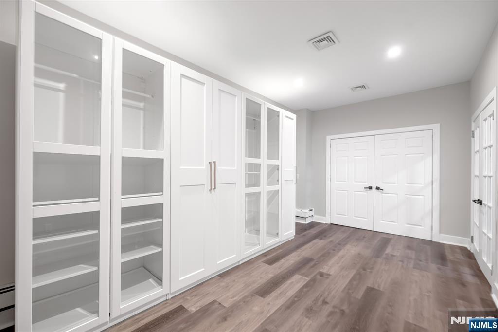 475 Cedar Lane Paramus, NJ 07652 - Photo 26 of 31 a view of a livingroom with wooden floor