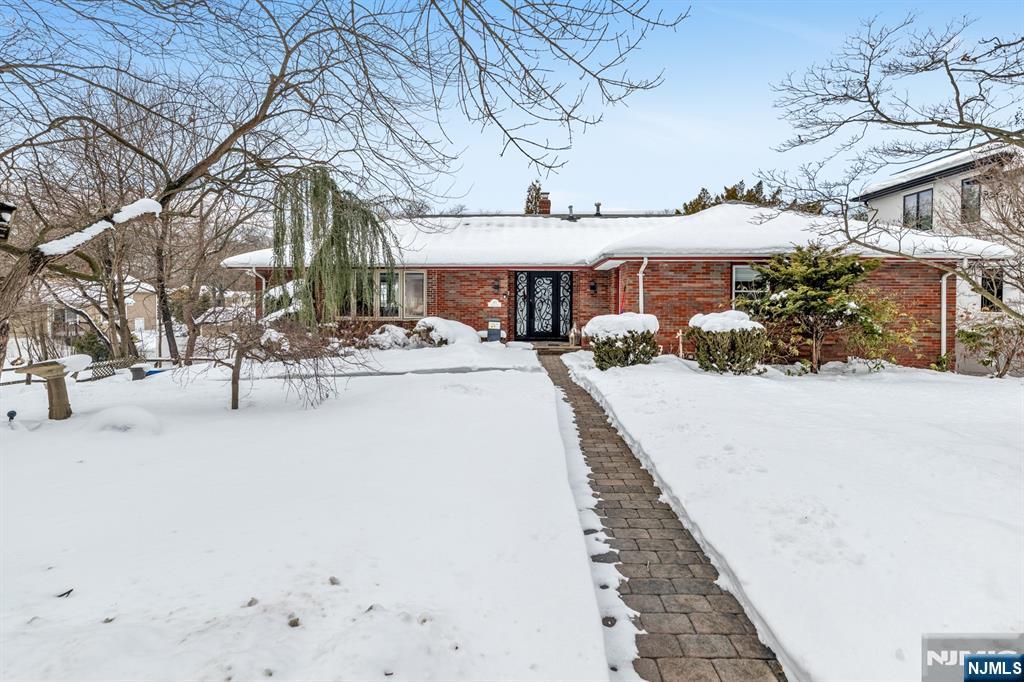475 Cedar Lane Paramus, NJ 07652 - Photo 28 of 31 a view of a building with snow on the road