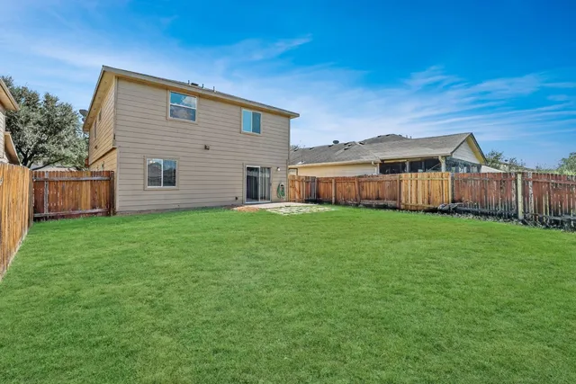 a view of a backyard with a garden