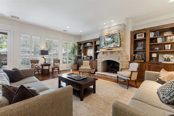 a living room with stainless steel appliances kitchen island granite countertop furniture and a kitchen view