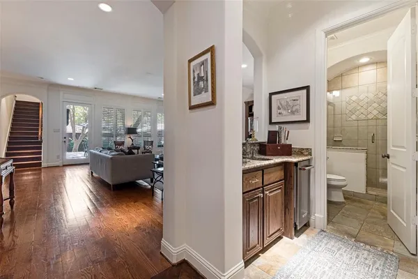 a large bedroom with bed and a large window