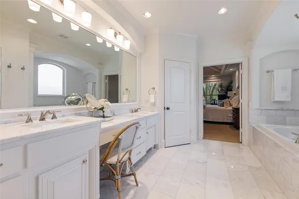 a living room with furniture a flat screen tv and a window