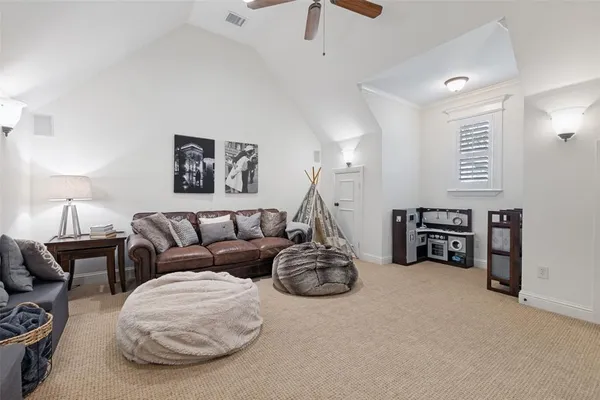 a bedroom with bed and a chandelier