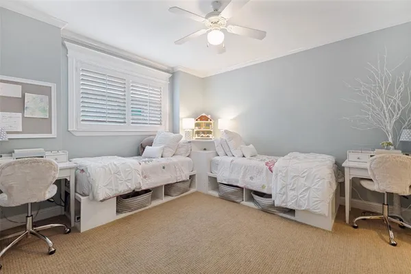 a bathroom with a sink a toilet a mirror a bathtub and shower