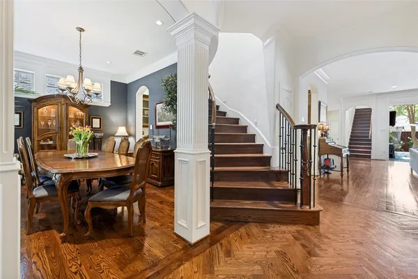 a view of entryway and hall with dining room