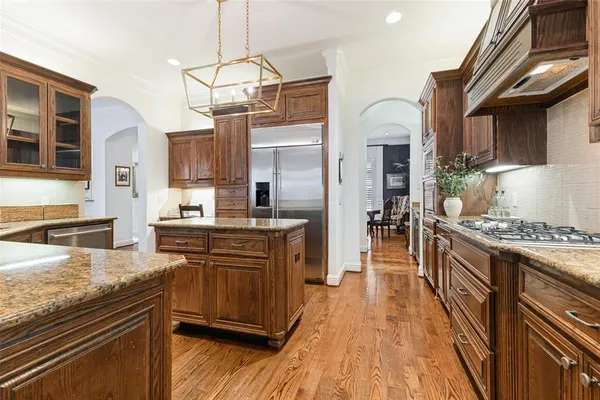 a living room with furniture large window and a fireplace