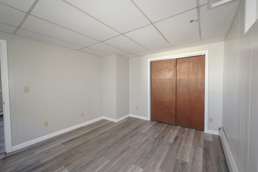 216 North River Road Lee, NH 03861 - Photo 36 of 41 a view of an empty room with wooden floor