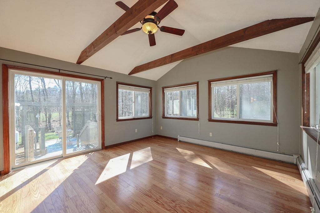 216 North River Road Lee, NH 03861 - Photo 10 of 41 a view of an empty room with wooden floor and a window