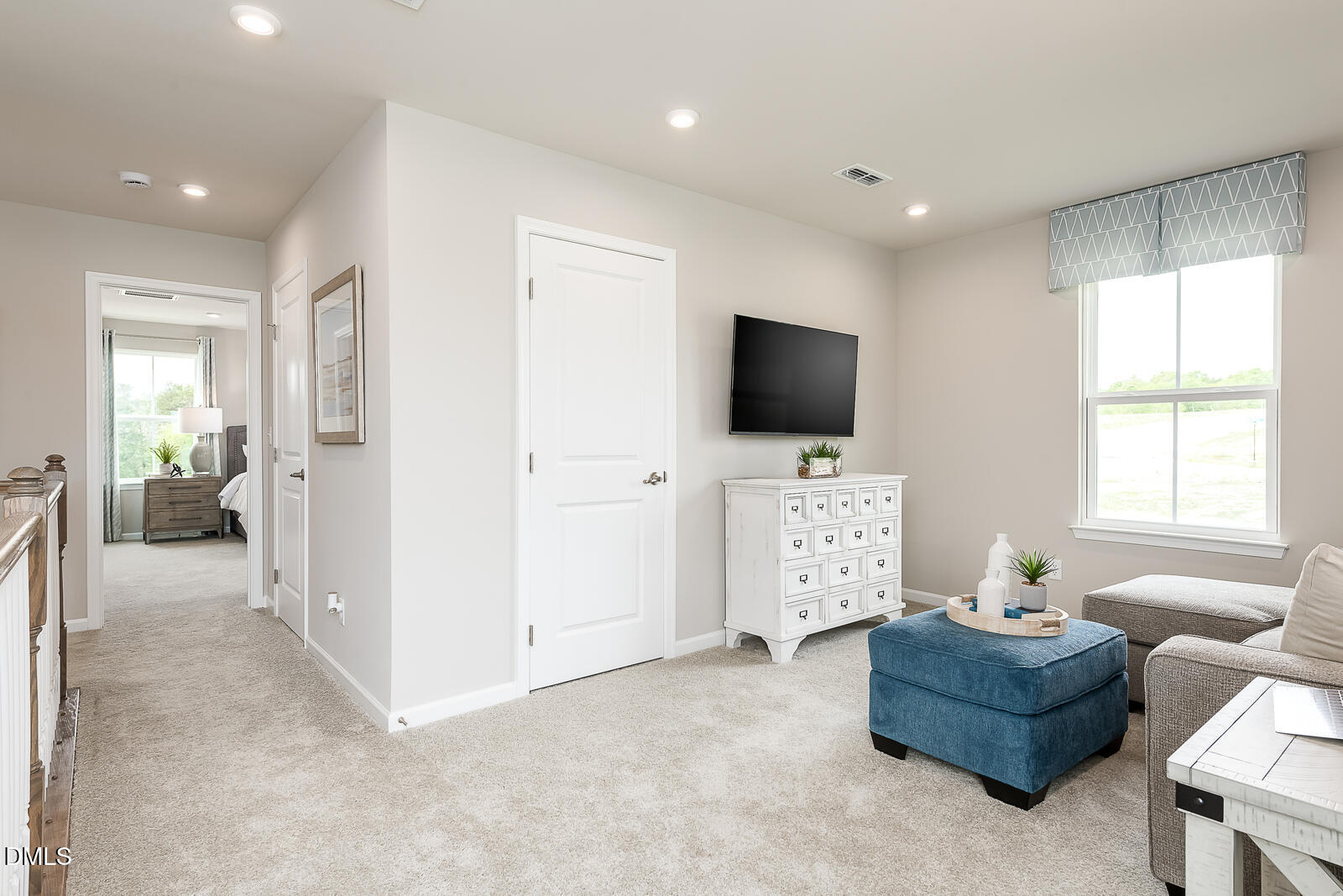 868 Walker Rdg Way Willow Spring, NC 27592 - Photo 16 of 28 a living room with furniture and a flat screen tv
