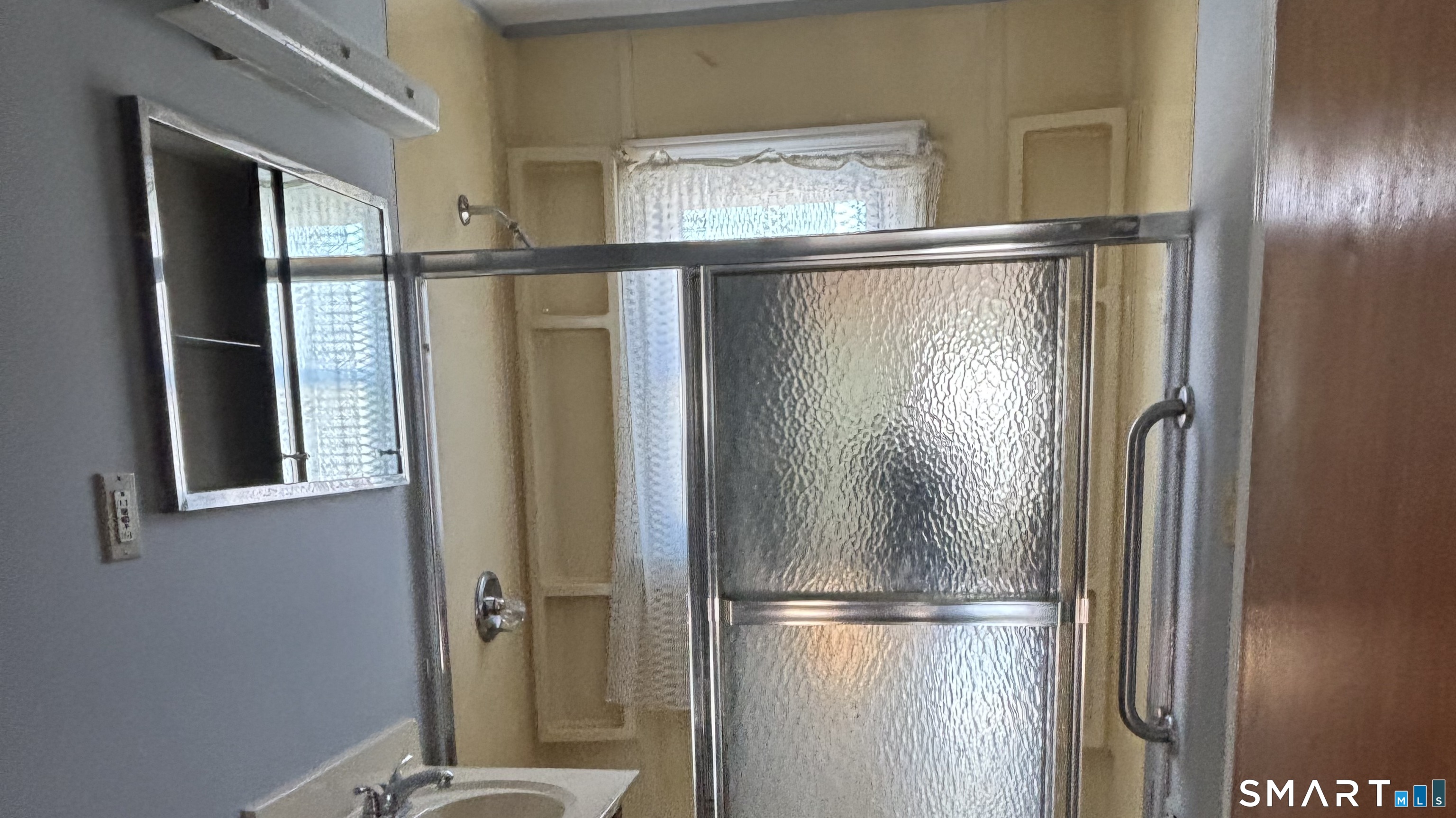 460 Stonybrook Road Stratford, CT 06614 - Photo 18 of 19 a bathroom with a glass shower door