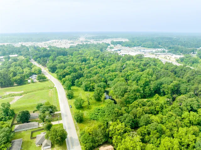 a view of a field with an ocean