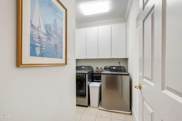 a view of a kitchen with stainless steel appliances granite countertop a stove and a refrigerator
