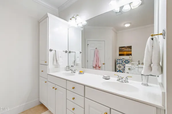 a view of bathroom with dual sinks