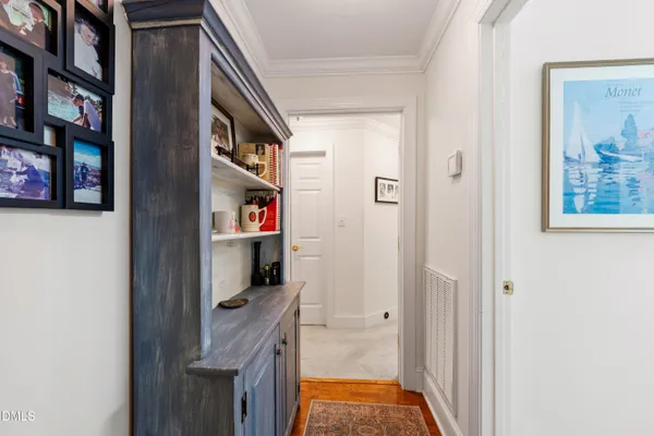a living room with fireplace furniture and decor