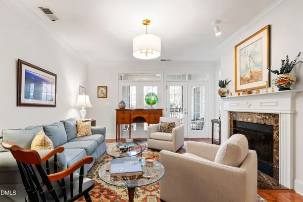 a view of an entryway with wooden floor