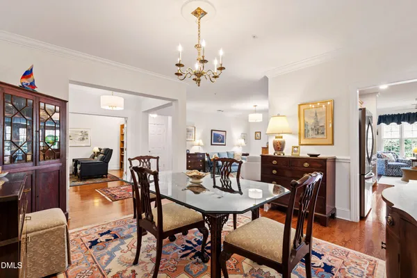 a kitchen with stainless steel appliances kitchen island granite countertop a stove a sink and a refrigerator