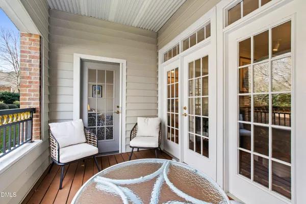 a hallway with a couch and a table in it