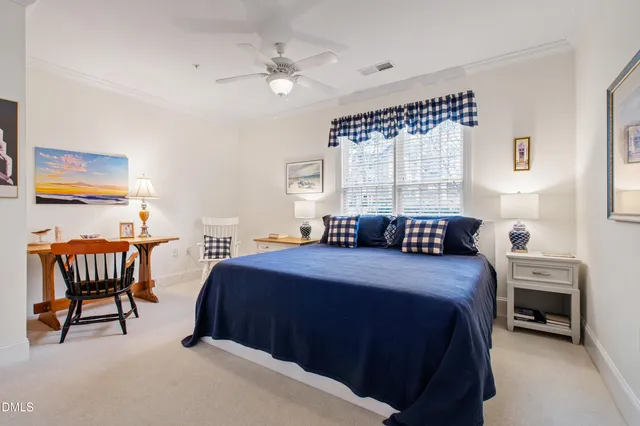 a bedroom with a bed and a table