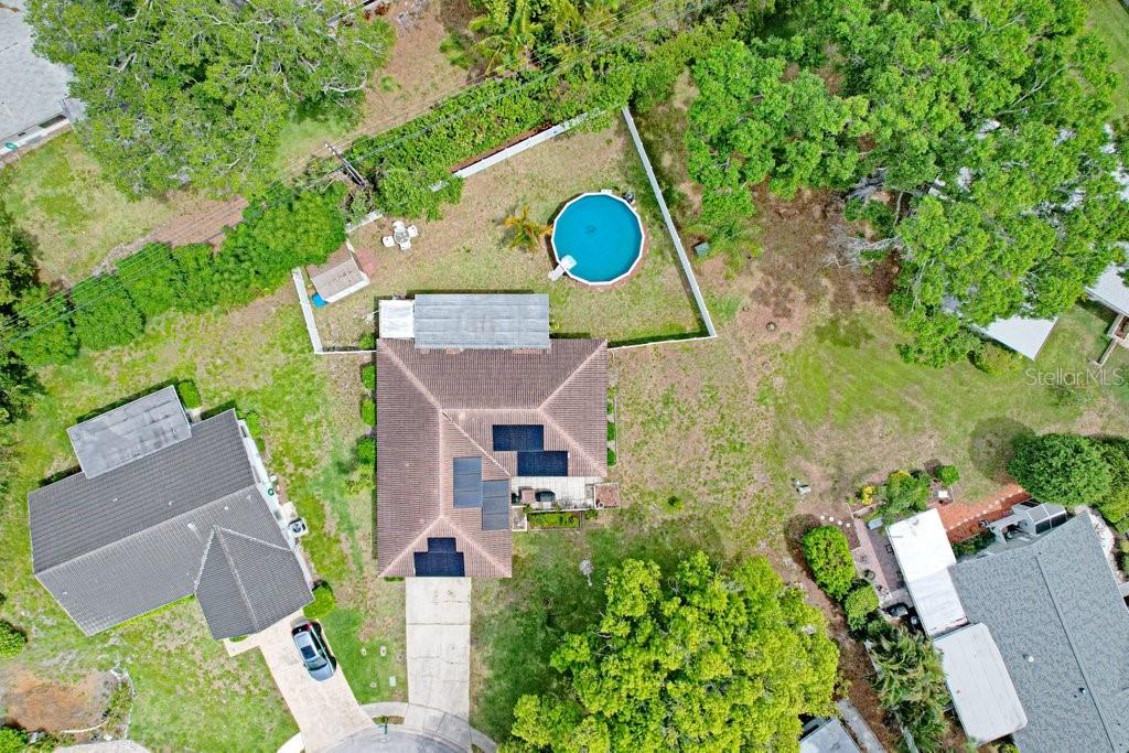 1632 Heather Place Palm Harbor, FL 34684 - Photo 22 of 53 an aerial view of a house with swimming pool and garden