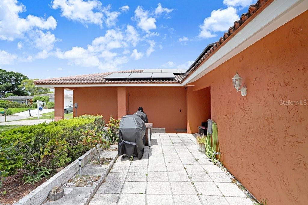 1632 Heather Place Palm Harbor, FL 34684 - Photo 23 of 53 a front view of a house with garden