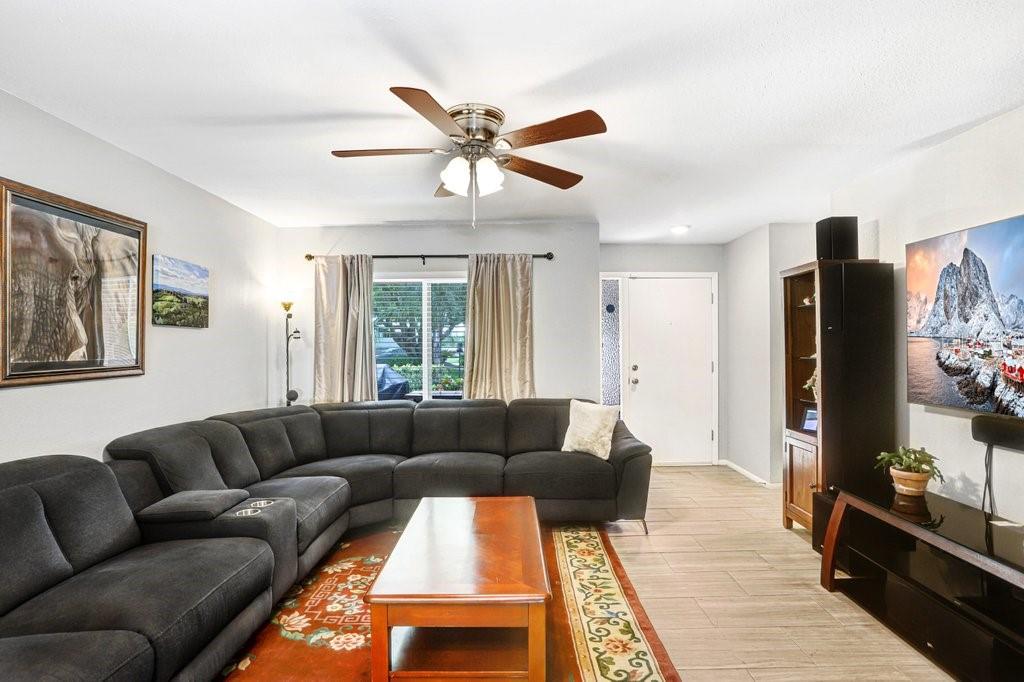 1632 Heather Place Palm Harbor, FL 34684 - Photo 26 of 53 a living room with furniture and a flat screen tv