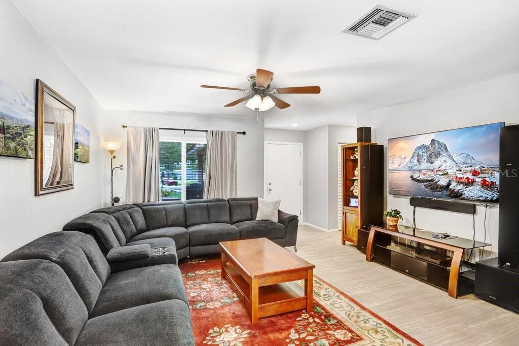 1632 Heather Place Palm Harbor, FL 34684 - Photo 27 of 53 a living room with furniture and a flat screen tv