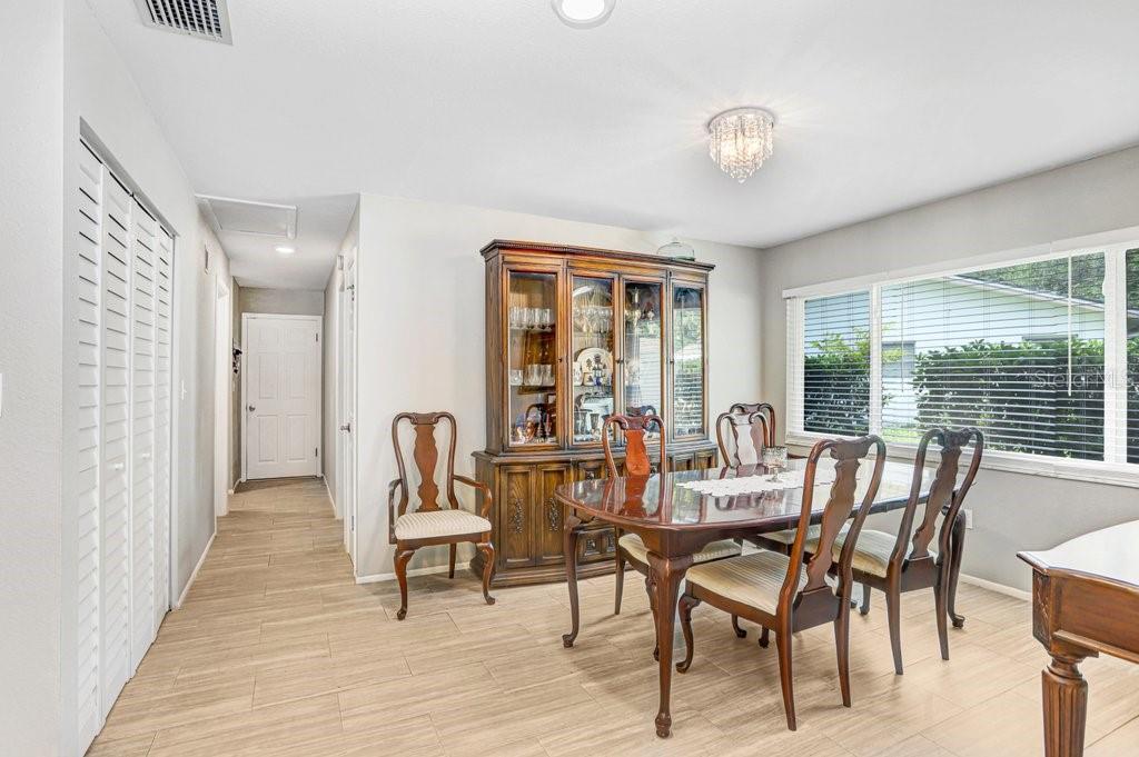 1632 Heather Place Palm Harbor, FL 34684 - Photo 30 of 53 a view of a dining room with furniture and wooden floor