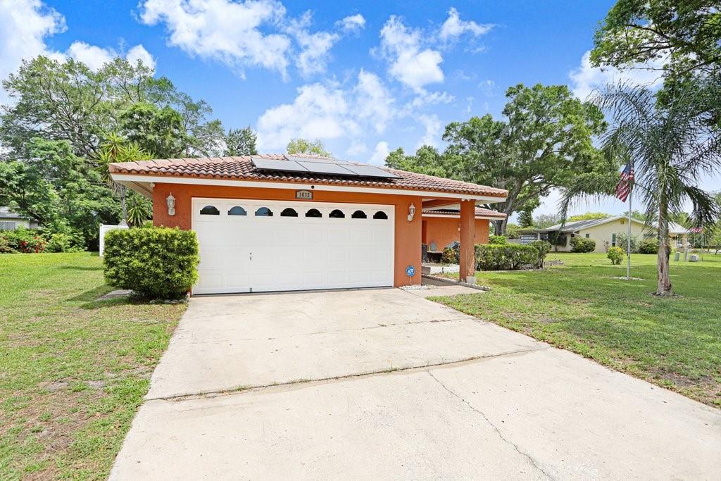 1632 Heather Place Palm Harbor, FL 34684 - Photo 3 of 53 a front view of a house with a yard