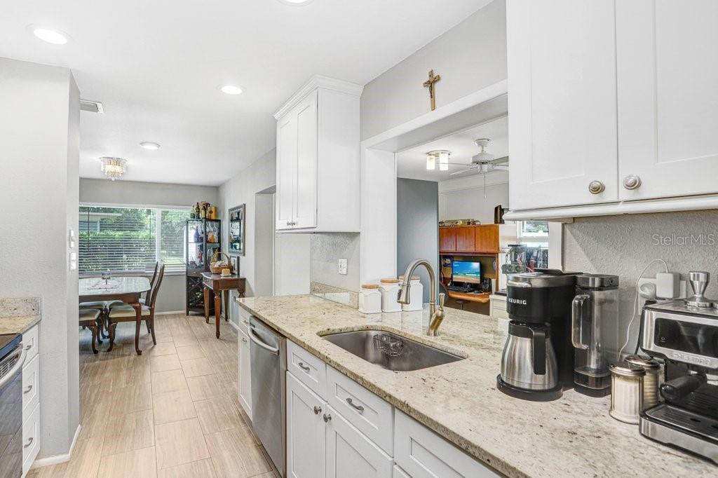 1632 Heather Place Palm Harbor, FL 34684 - Photo 33 of 53 a kitchen with counter top space cabinets and appliances